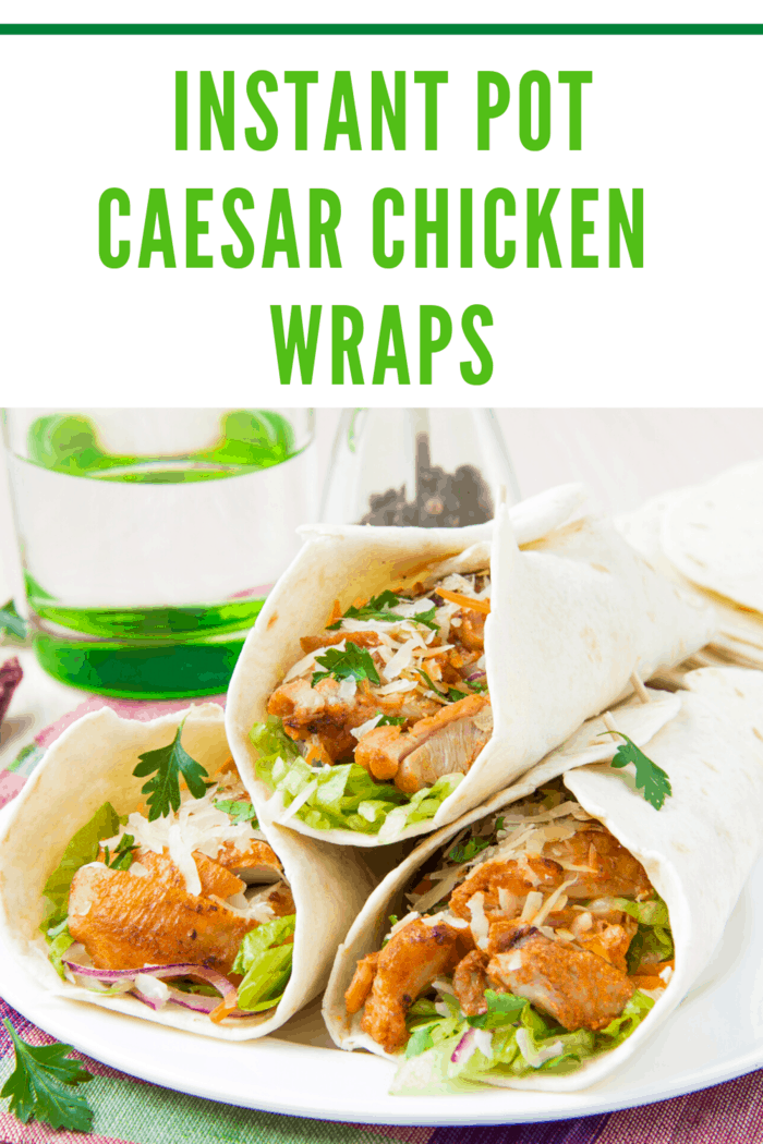 three instant pot caesar chicken salad wraps stacked on plate