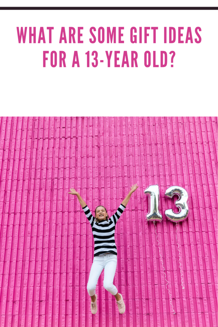 Teen girl jumping up for thirteenth birthday