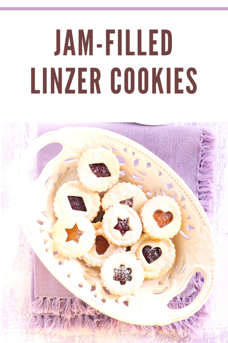 Linzer Cookies are a simple sandwich of buttery shortbread filled with a colorful jam poking through creating a colorful window.