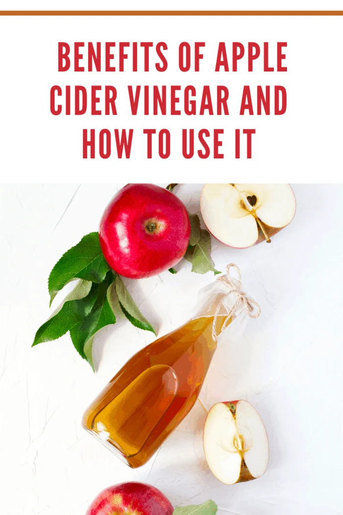 Apple cider vinegar and fresh apples, top view