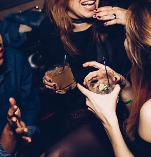 women having cocktails at end of day at ski resort