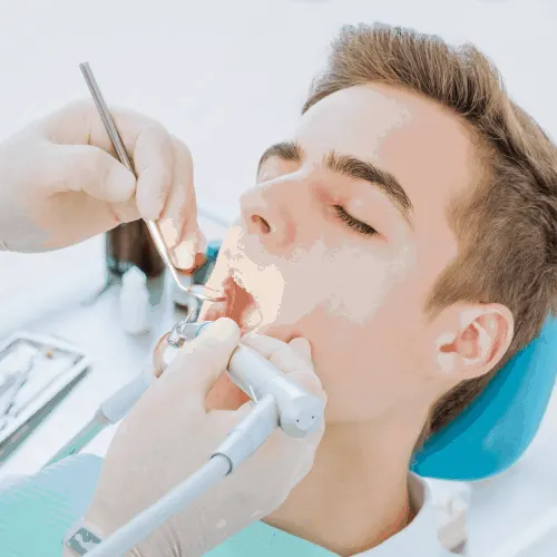 Dental root canal procedure.Teenage boy at the dentist's chair during a dental procedure, smile close up. Healthy Smile. Beautiful male Smile