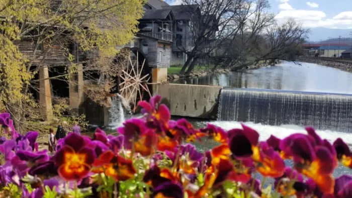 old mill with flowers pigeon forge