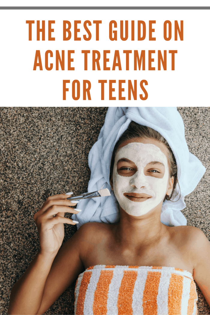 Lifestyle image of 12-14 years old teen applying organic fruit facial mask with papaya. Top view photo of teenage girl wrapped in towel doing anti blemish face treatment by the pool side.