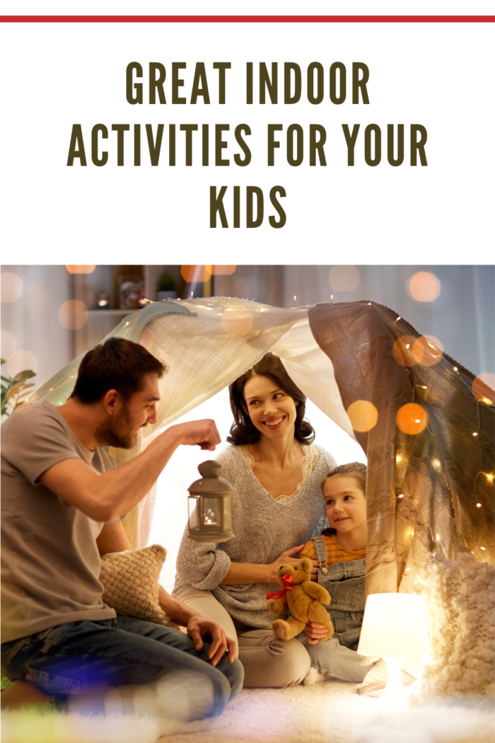 Happy Family Playing in a Homemade Blanket Fort