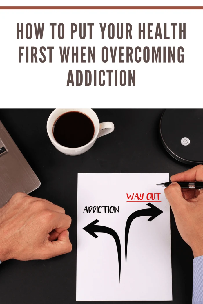 man drawing on paper arrow pointing to addiction and arrow pointing to the right as way out