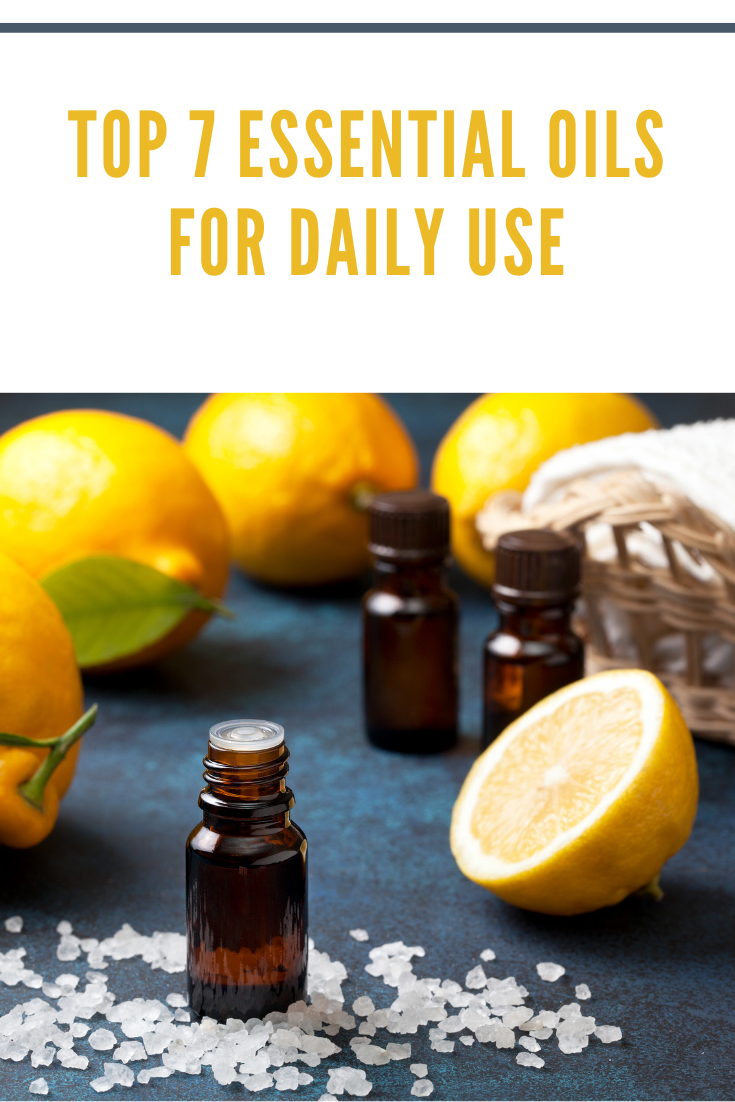 lemon essential oil with sliced lemon