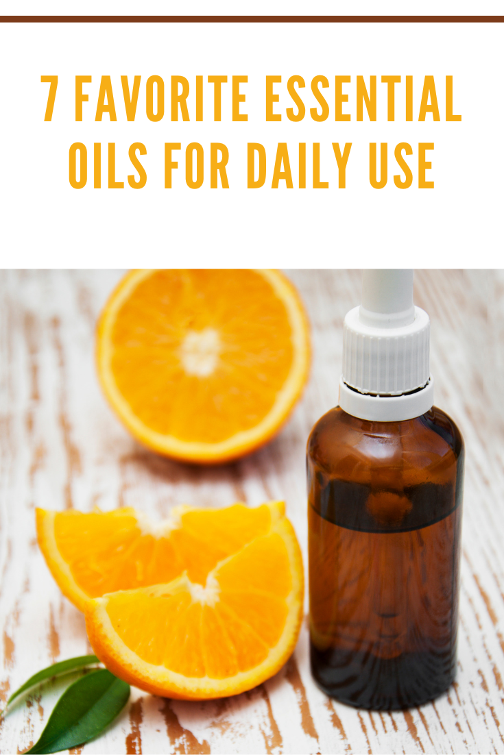 orange essential oil with orange slices