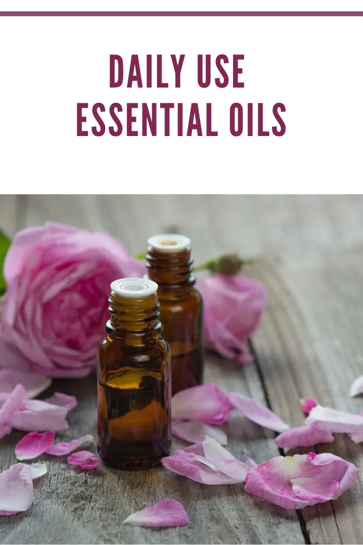 rose essential oil with rose petals