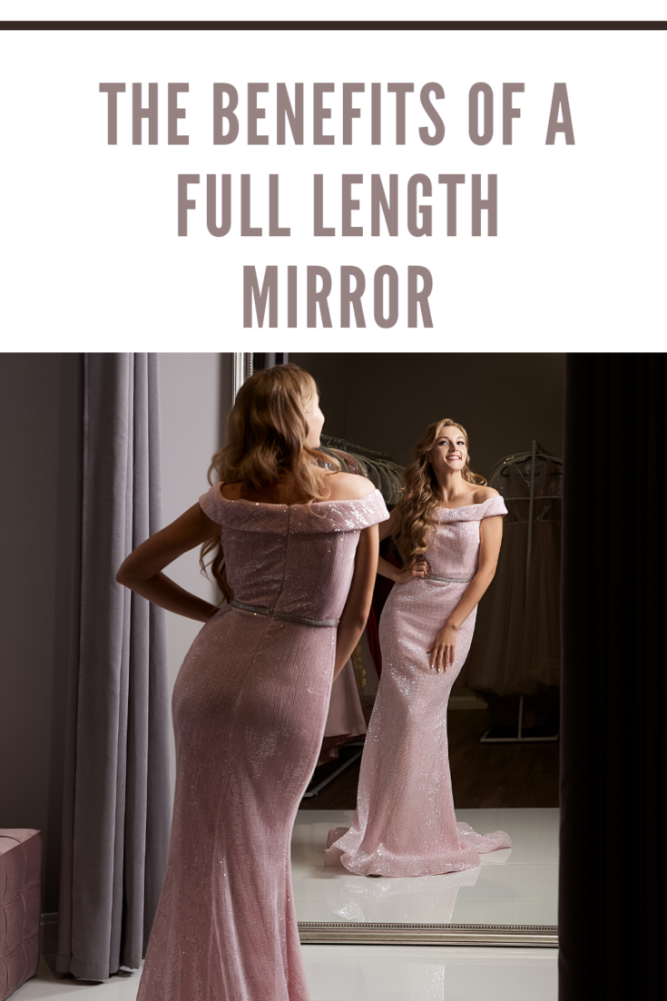Woman Wearing Full-Length Pale Pink Dress in Front of Mirror