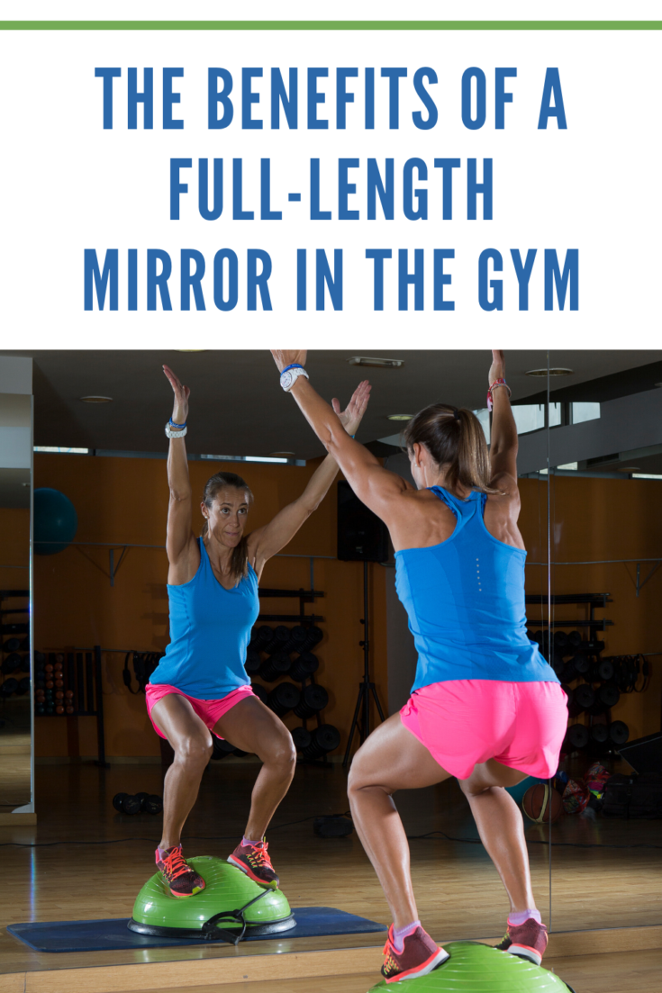 Woman exercising in a gym in front of mirror