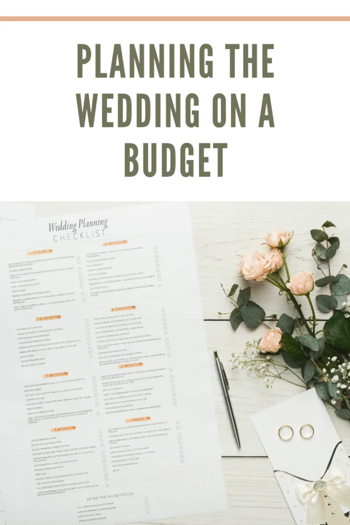 Wedding background with checklist. Paper planner and wedding rings on white wooden table with tender bridal bouquet, top view