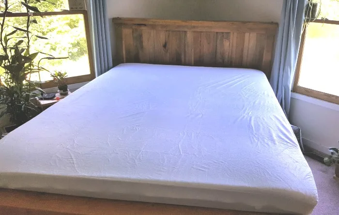 bed with waterproof mattress cover
