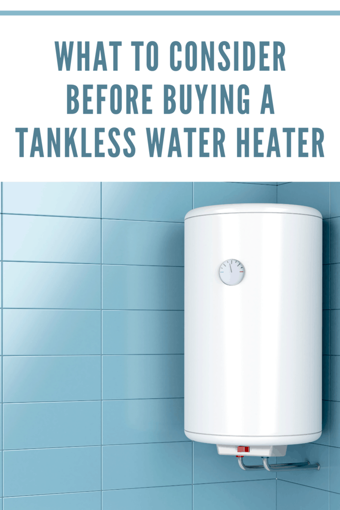 tankless water heater on blue tiled wall