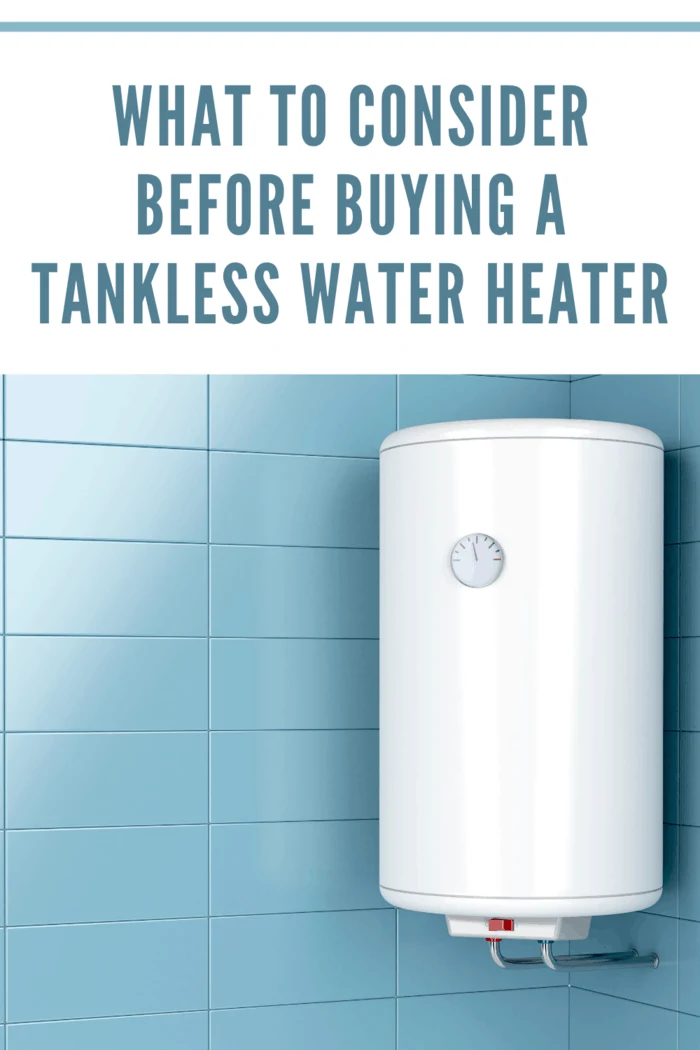 tankless water heater on blue tiled wall