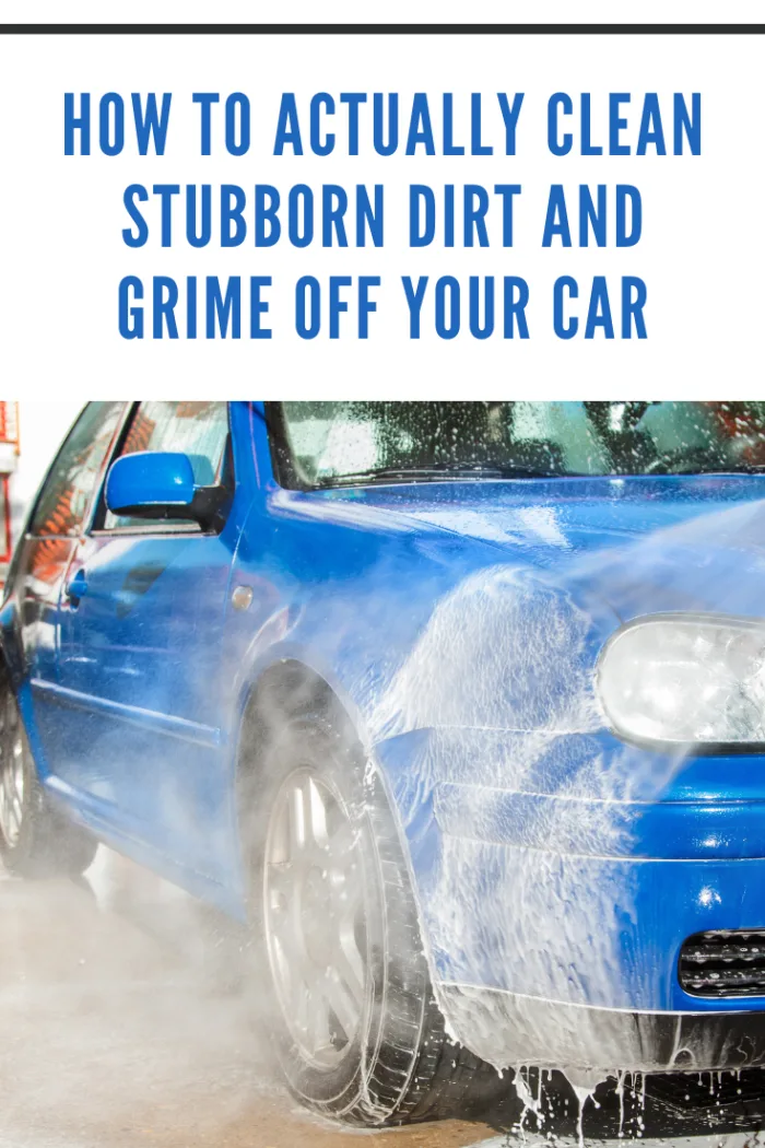 A blue car being cleaned at a car wash to remove grime safely