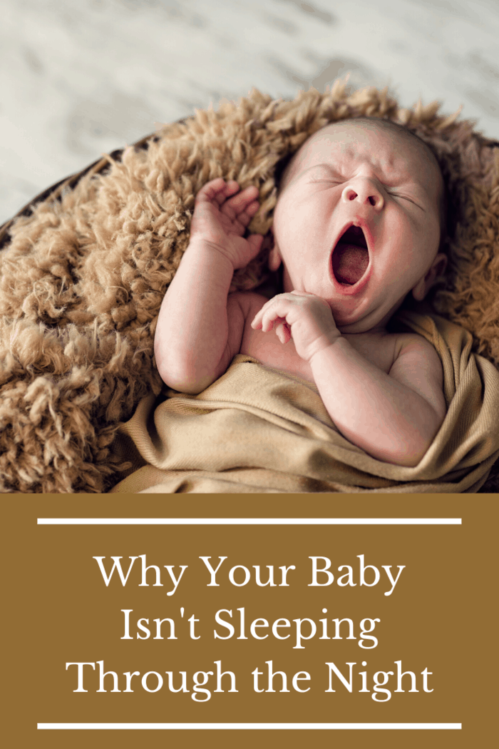 newborn not sleeping through the night, yawning wide on brown furry blanket