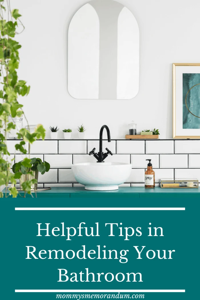 white subway tiles behind bowl sink in bathroom with ivy plant on wall