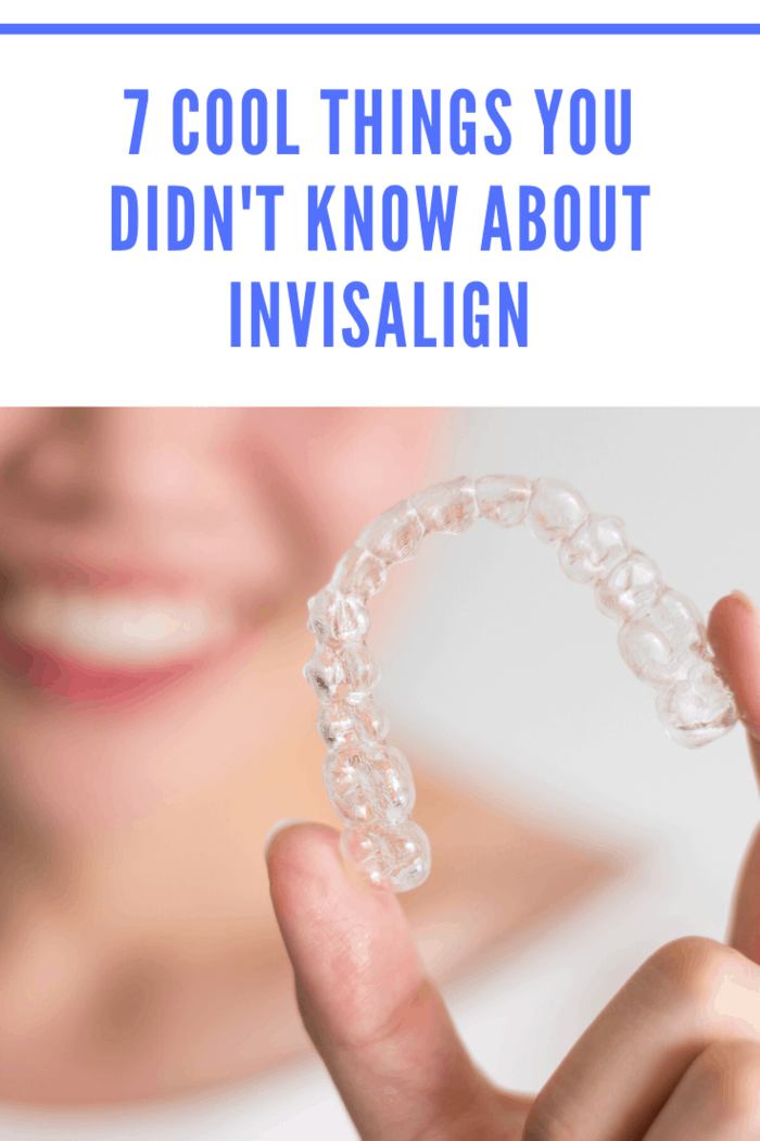 Woman holding Invisalign aligners demonstrating clear, nearly invisible orthodontic solution