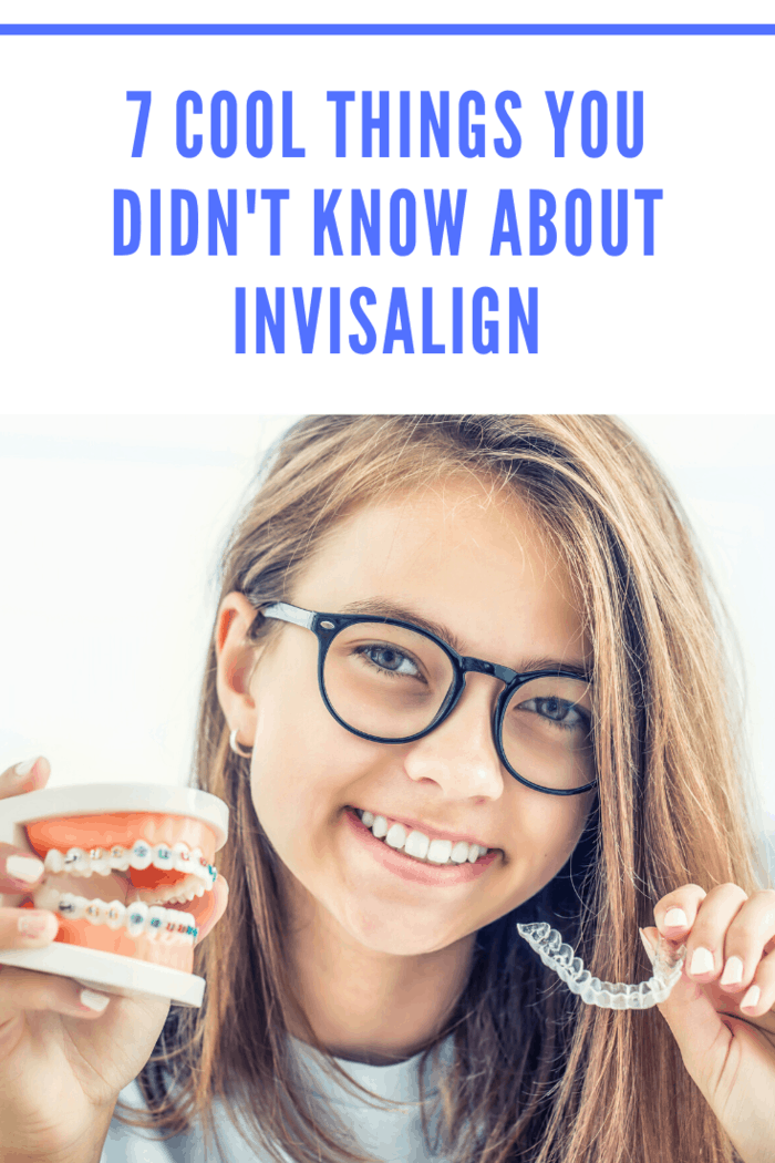 Girl holding traditional braces model in one hand and Invisalign aligners in the other, showing differences