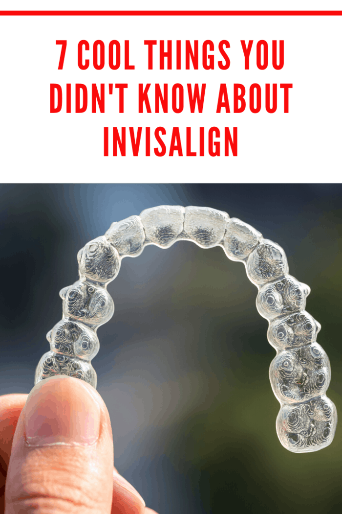 Close-up of Invisalign aligners held in hand, showcasing nearly invisible orthodontic solution