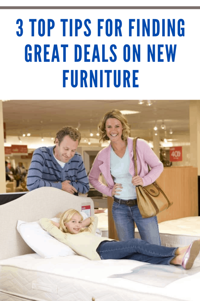 family of three shopping with daughter testing out mattress as parents look on