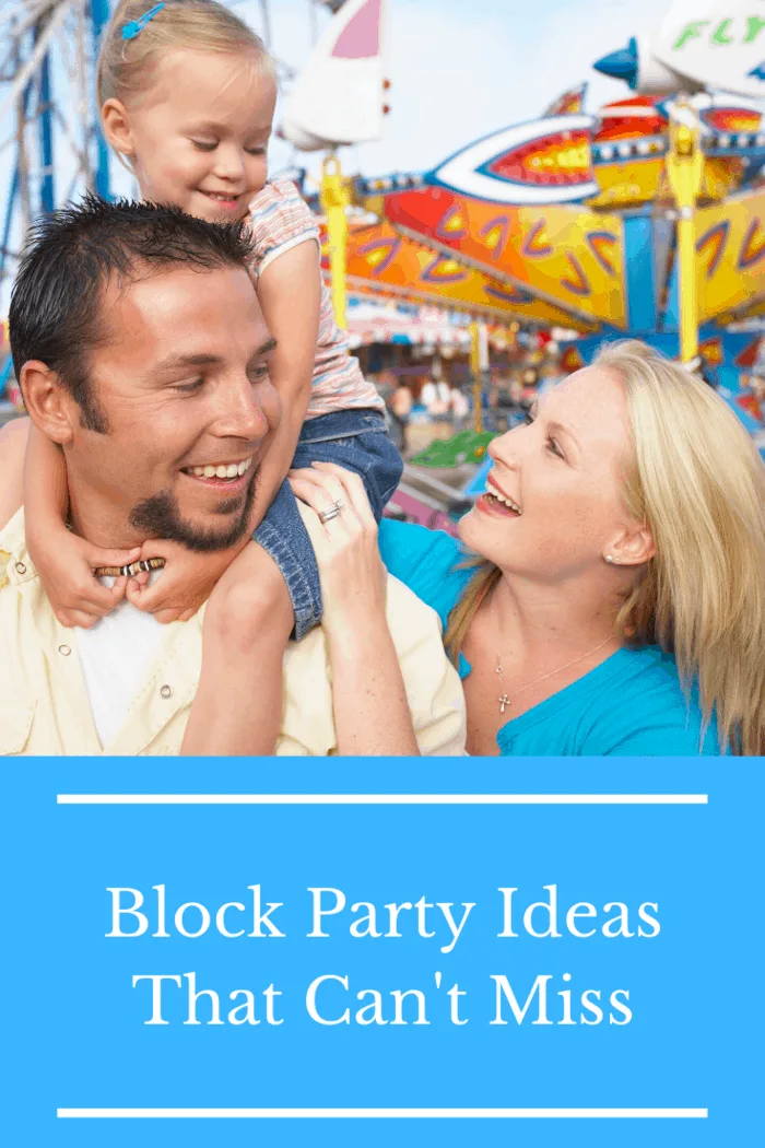 Happy family enjoying a block party with carnival rides