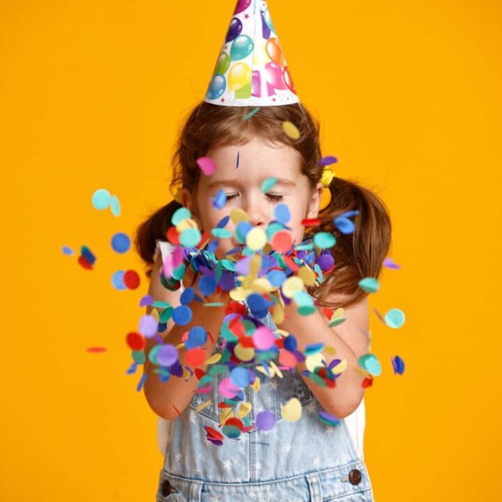 birthday girl blowing confetti
