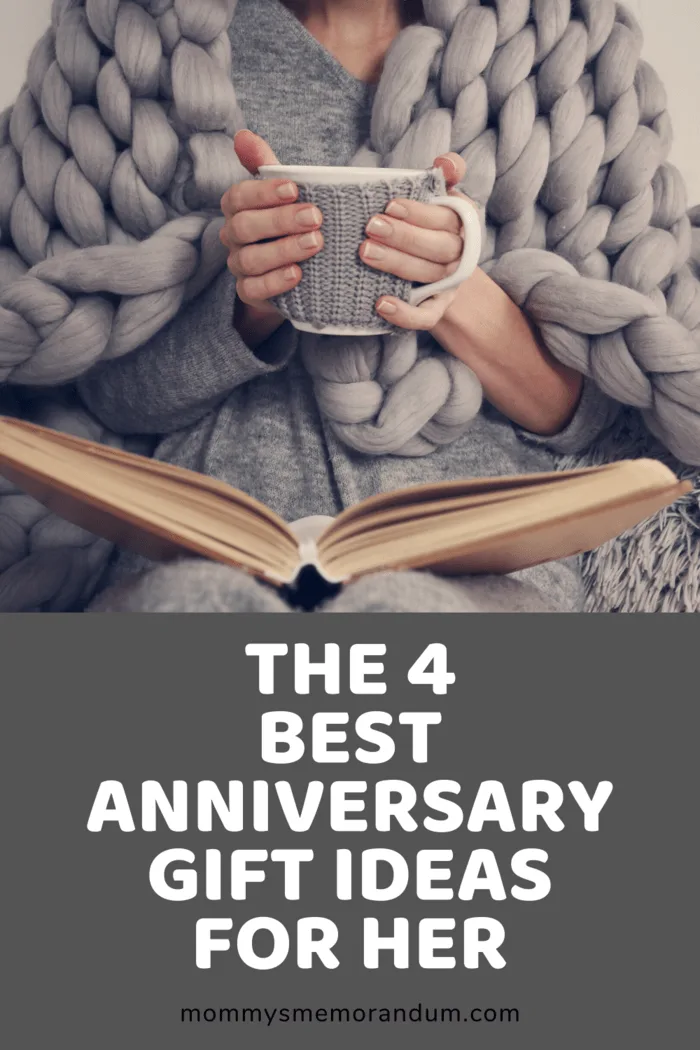 wam thick gray blanket over woman with cup of coffee in hands and book in lap