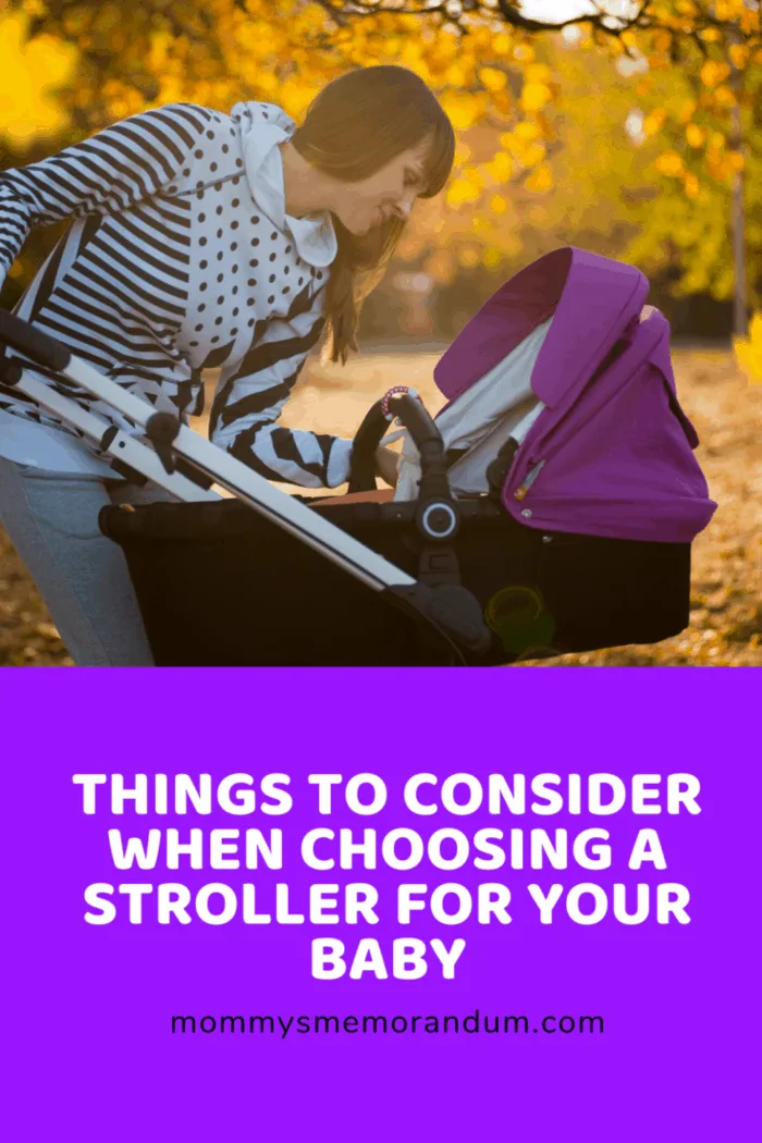 mom peeking into baby stroller to check in on baby