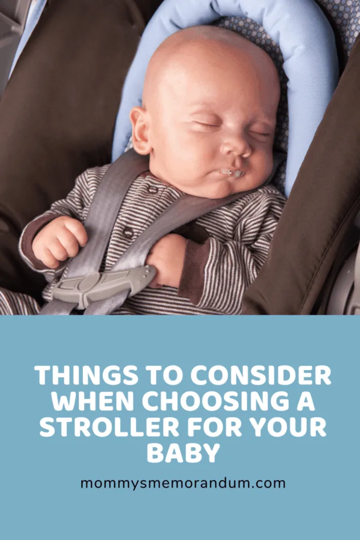 baby boy sleeping in stroller with head rest