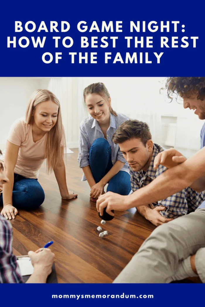 family playing game with dice on wooden floor