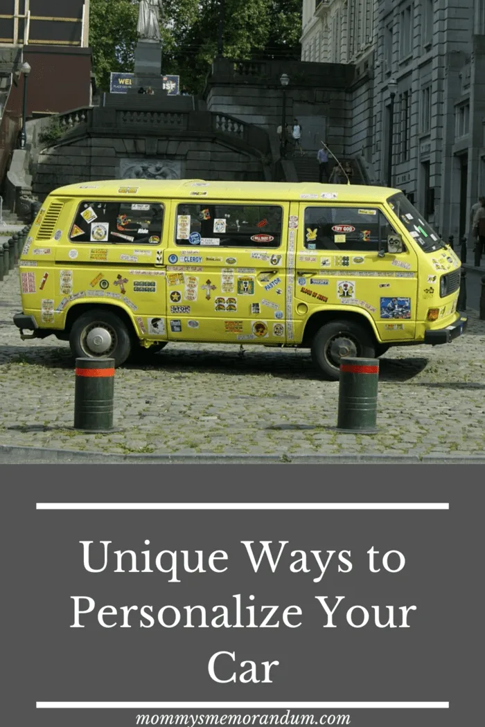 yellow volkswagon bus covered with tourist site bumper stickers