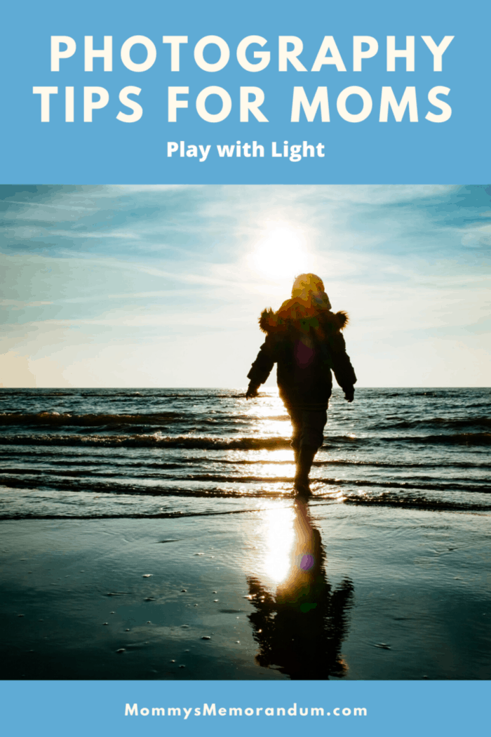 photograph of child on beach outlined by sunburst