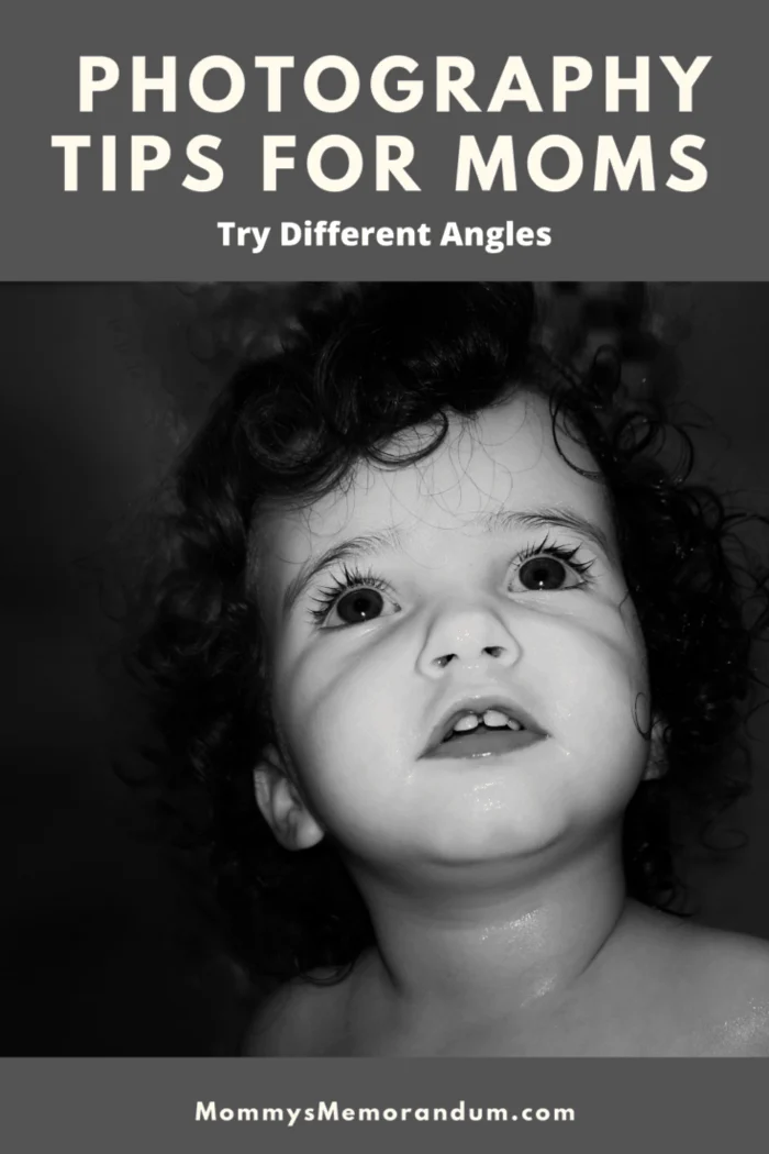 black and white photo of child looking up