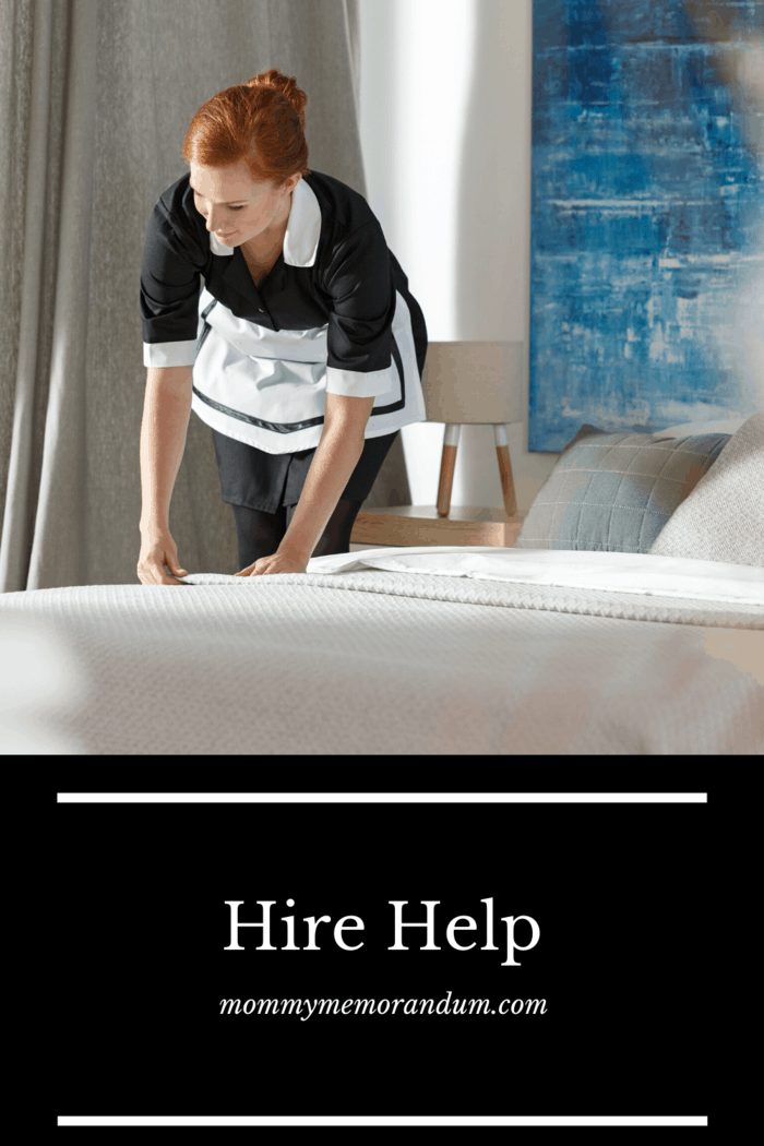 hired maid making bed