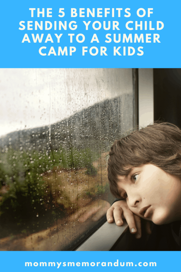 child looking out window at rain