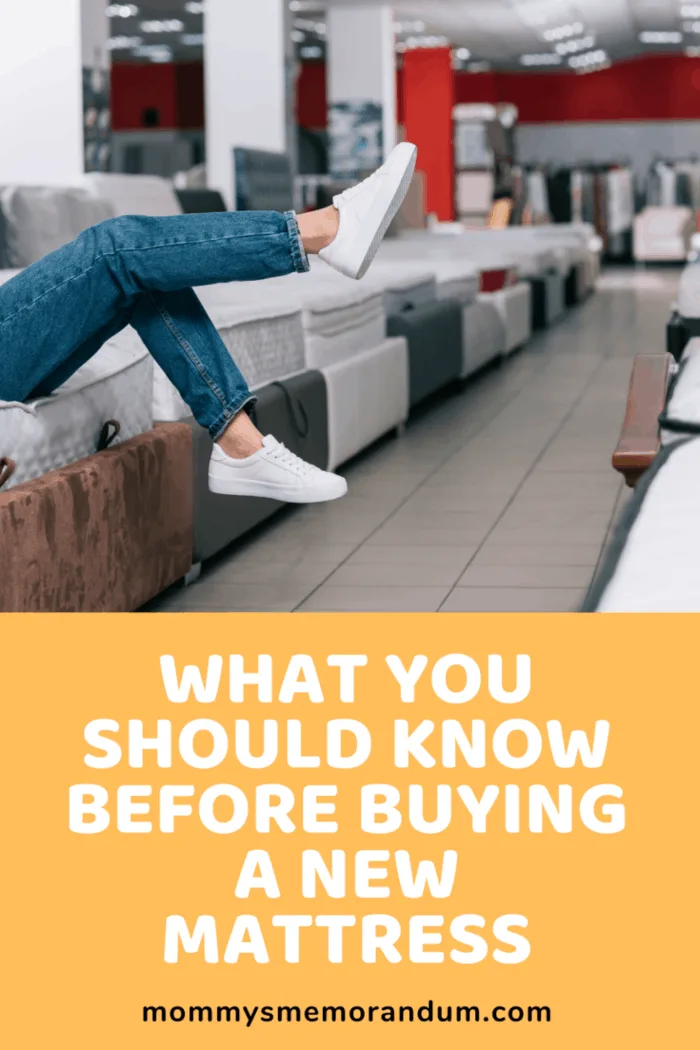 legs and feet hanging over mattress while buying mattress