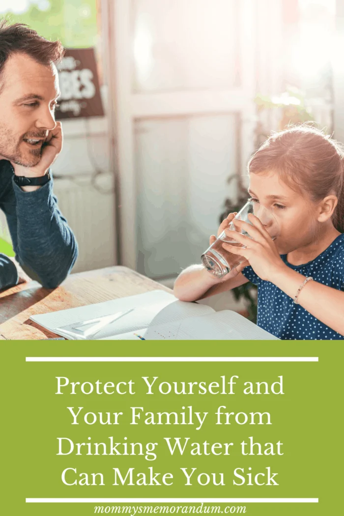 dad at table with daughter who is drinking water free of contaminants