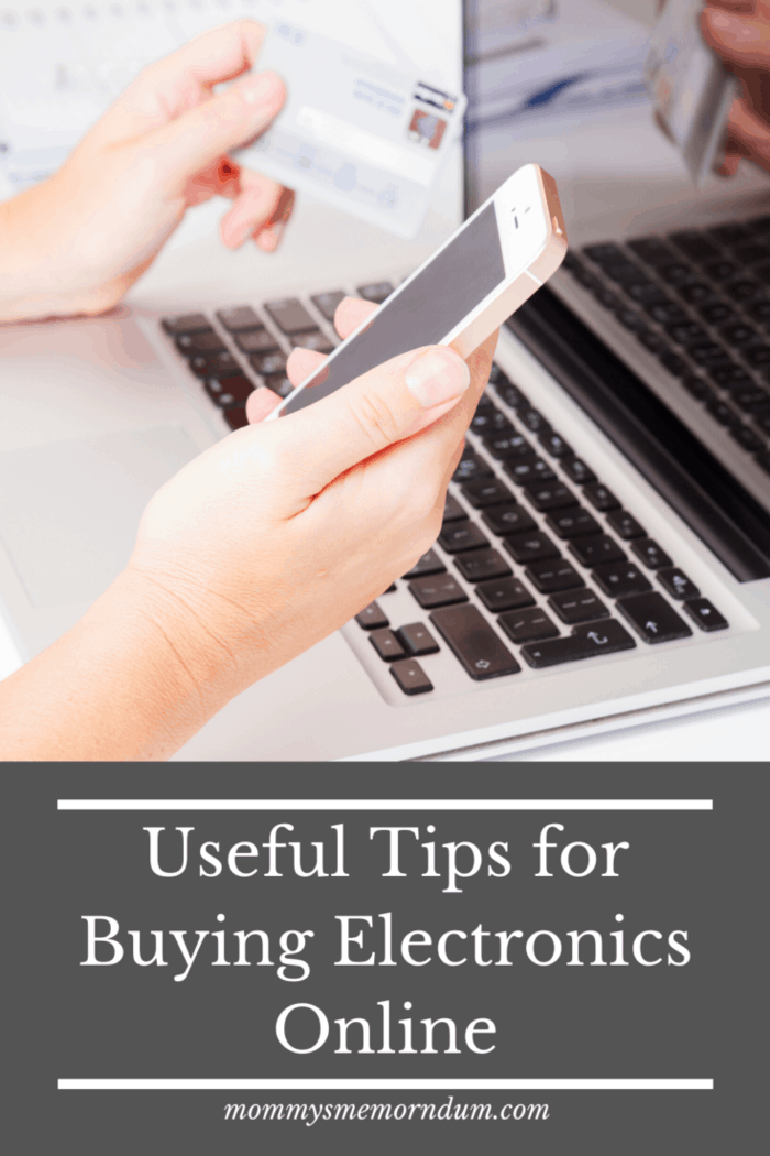 person on laptop and smartphone with credit card buying electronics online