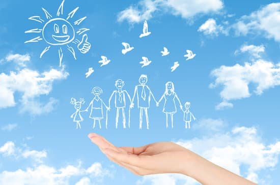 drawing of family on blue sky with clouds background with hand underneath
