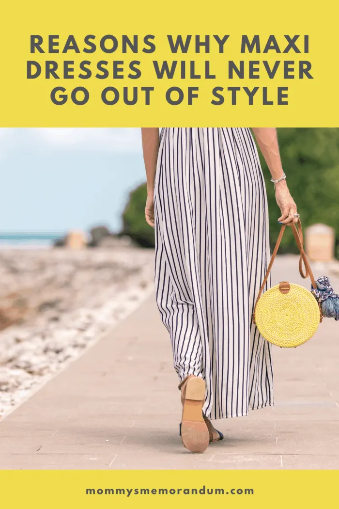 woman strolling along beach in maxi dress