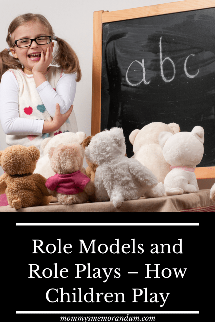 child role playing as teacher to stuffed animals