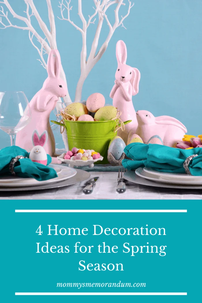 Easter centerpiece with pink rabbits and colored easter eggs.