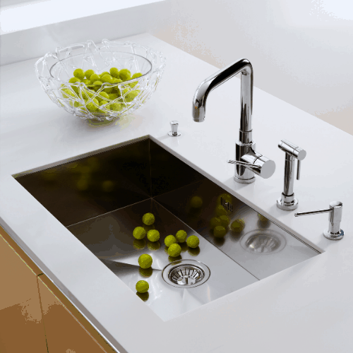 the kitchen sink of silvery color with fitted taps
