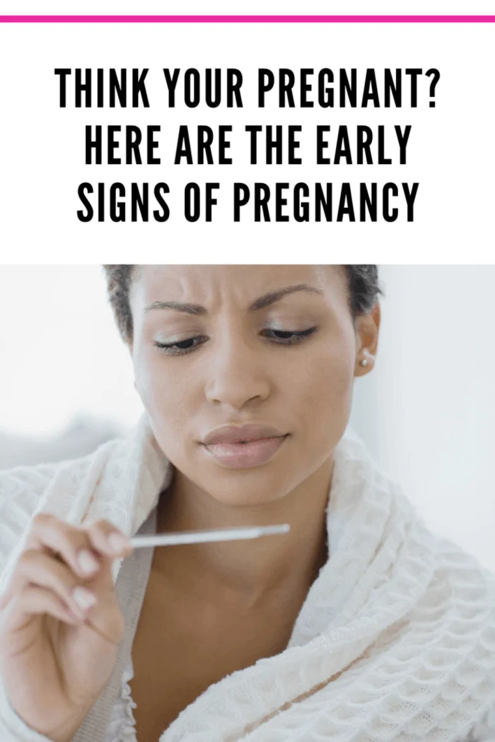woman checking temperature for early signs of pregnancy