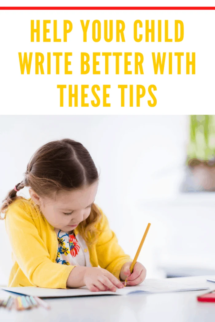 small girl with yellow cardigan writing in notebook