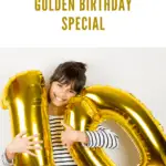 A young girl holding golden number balloons, celebrating her special golden birthday with a big smile.