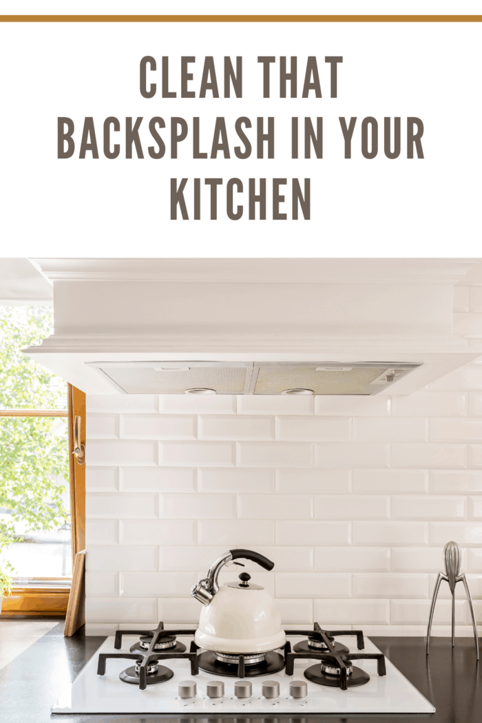 teapot on stove with backsplash in kitchen