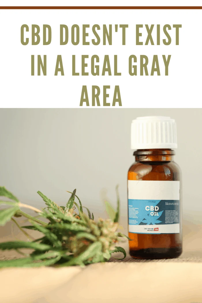 bottle of cbd oil with hemp leaf